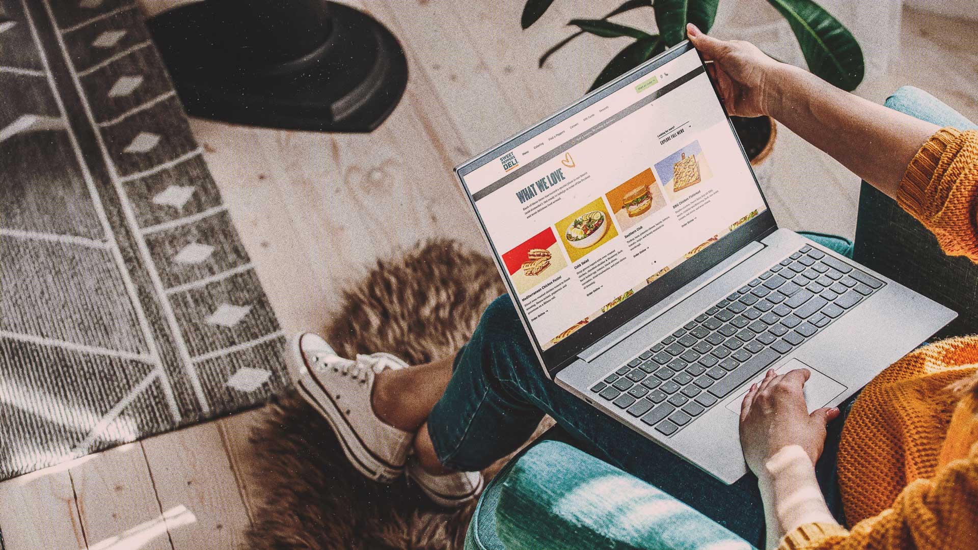 Sweet Peppers Deli Website on a laptop